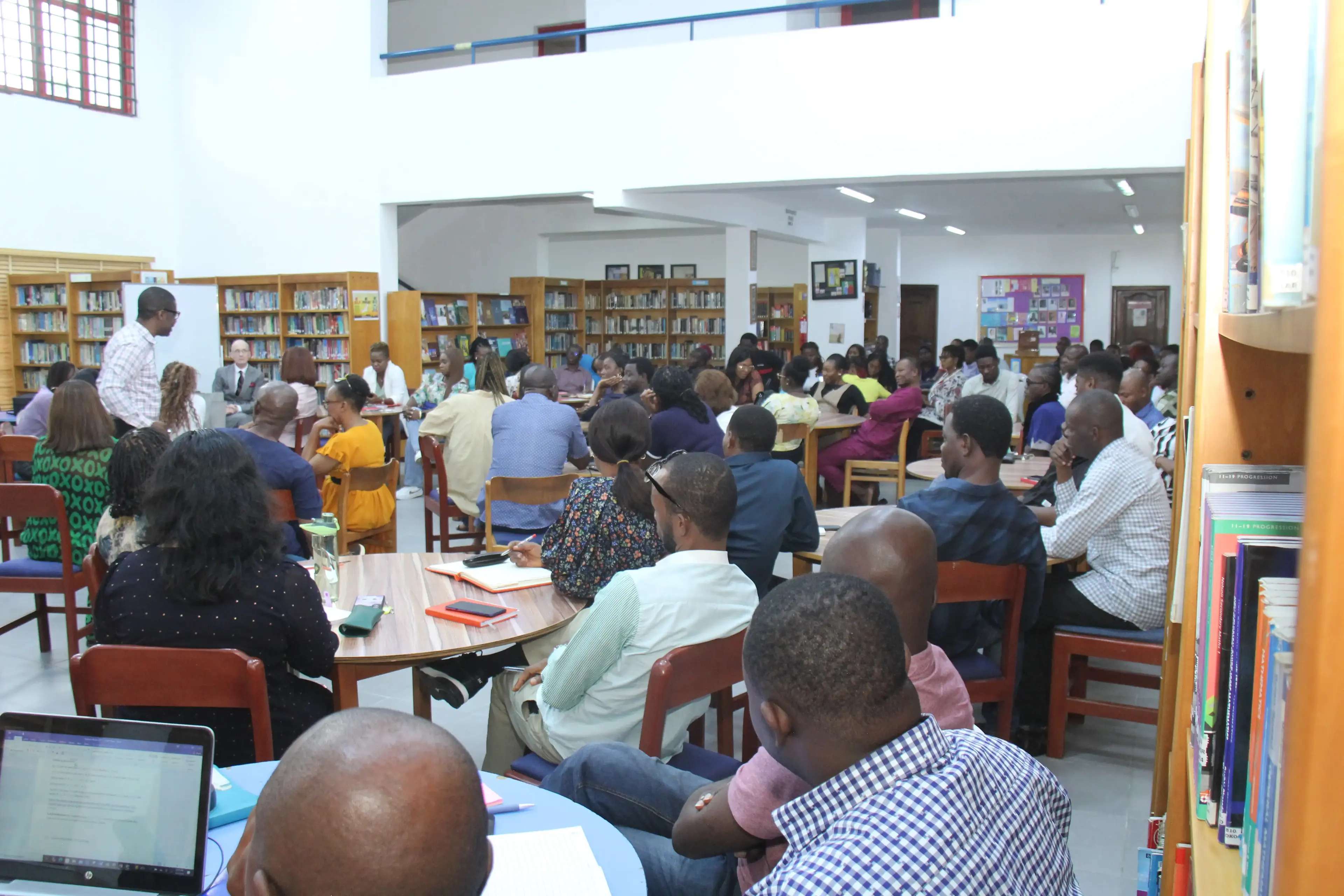 A full room of adult teacher trainees during an AZICTIVO professional development session